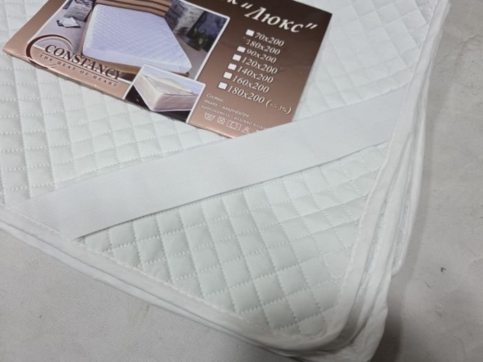 Наматрацник "Constansy-Люкс" 0834/ 80*200 з тканини мікрофібра та з наповненням з волокна холлофайбер +з резинками по кутах